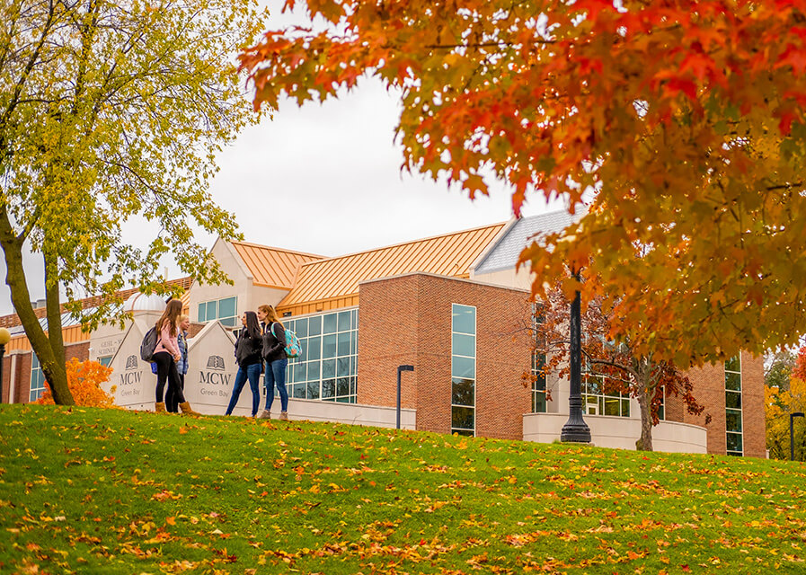 Students stand outside the Medical College of Wisconsin building, located on the St. Norbert College campus.