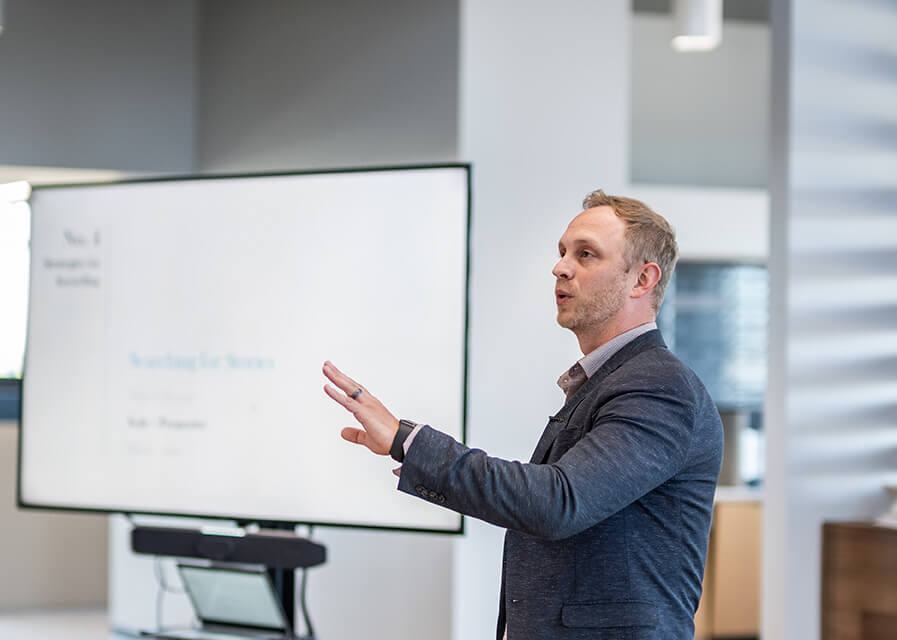 Professor presents data to a class.