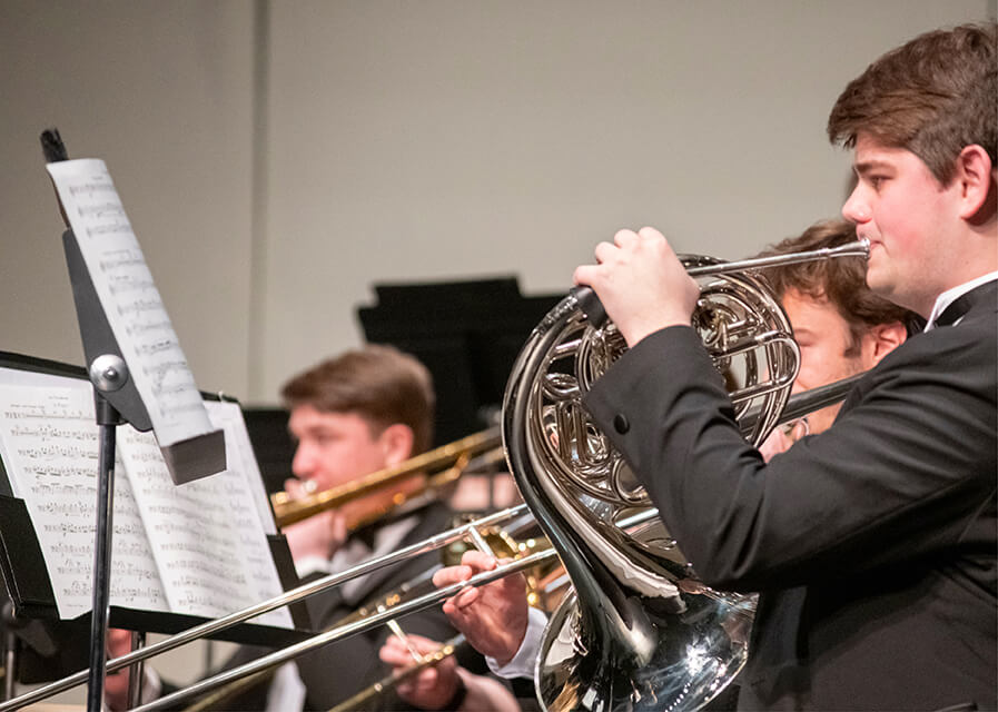 Close up of students playing instruments in a band